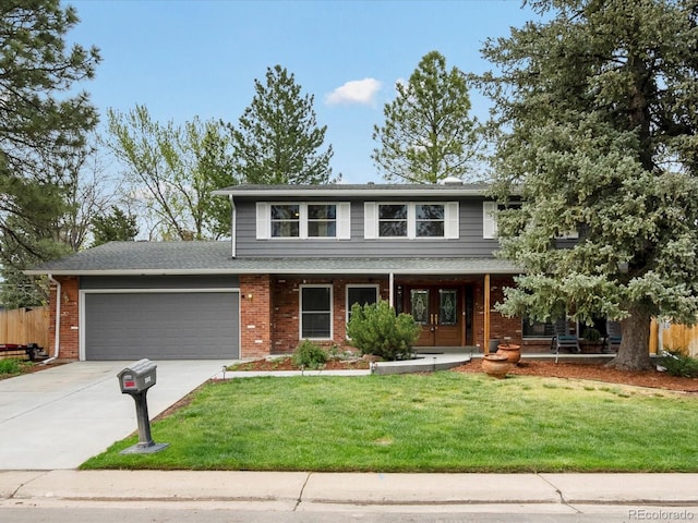 5845 W Portland Dr, Littleton, CO 80128 - view of front of house with an attached garage, driveway, covered porch, and brick siding