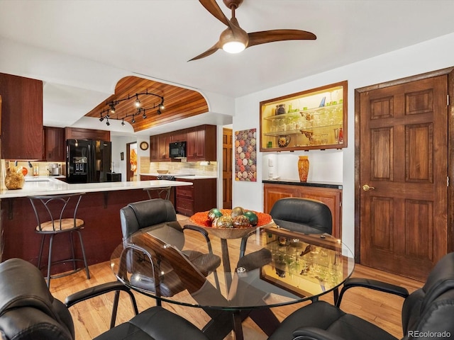 5845 W Portland Dr, Littleton, CO 80128 - living room featuring light wood finished floors and a ceiling fan