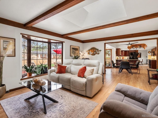 5845 W Portland Dr, Littleton, CO 80128 - living area featuring beam ceiling, light wood-style floors, and ceiling fan