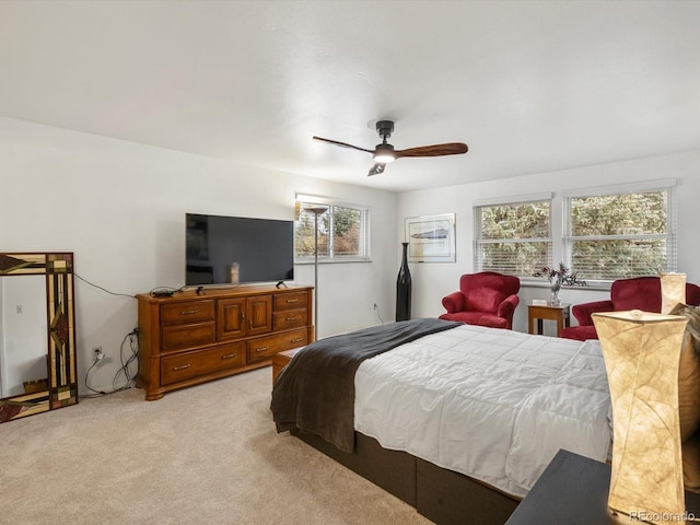 5845 W Portland Dr, Littleton, CO 80128 - bedroom with light colored carpet and a ceiling fan