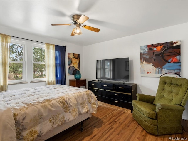 5845 W Portland Dr, Littleton, CO 80128 - bedroom featuring wood finished floors and ceiling fan