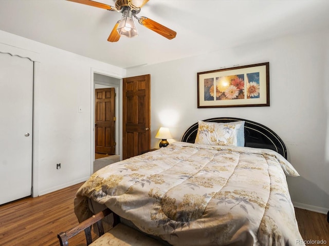 5845 W Portland Dr, Littleton, CO 80128 - bedroom featuring baseboards, wood finished floors, and a ceiling fan