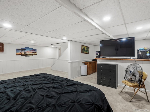 5845 W Portland Dr, Littleton, CO 80128 - bedroom with light colored carpet, a paneled ceiling, recessed lighting, and a wainscoted wall