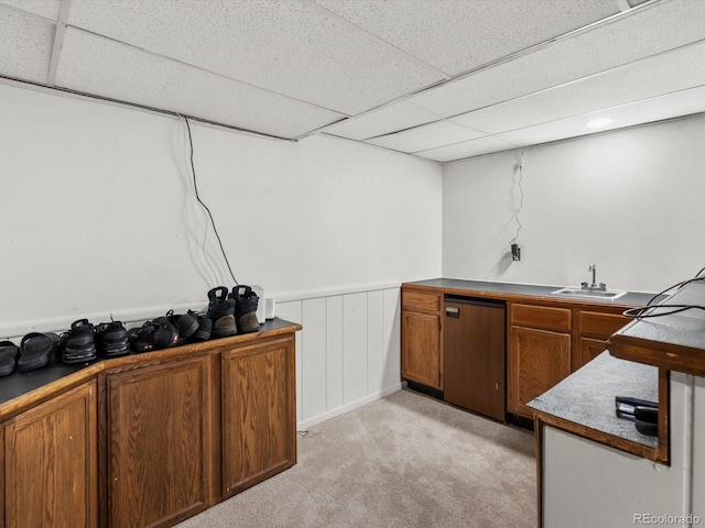 5845 W Portland Dr, Littleton, CO 80128 - bar area featuring a drop ceiling, light colored carpet, refrigerator, a wainscoted wall, and a sink