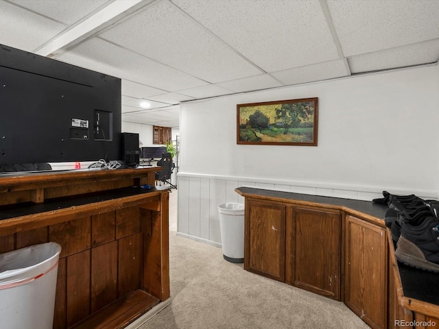 5845 W Portland Dr, Littleton, CO 80128 - office area featuring light colored carpet, a paneled ceiling, and wainscoting