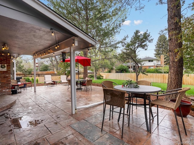 5845 W Portland Dr, Littleton, CO 80128 - view of patio / terrace with outdoor dining area and a fenced backyard