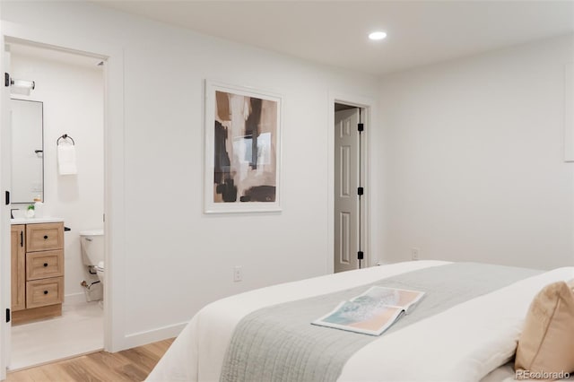 4395 Newland St, Wheat Ridge, CO 80033 - bedroom with light wood-style flooring and recessed lighting