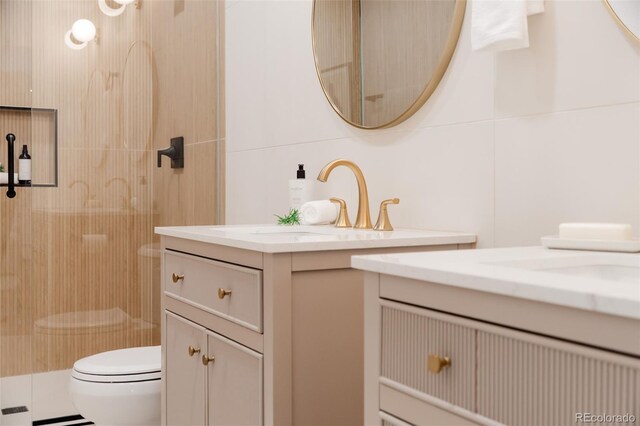 4395 Newland St, Wheat Ridge, CO 80033 - full bath with vanity, toilet, and a stall shower