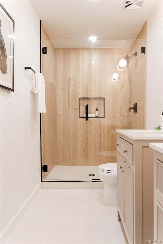 4395 Newland St, Wheat Ridge, CO 80033 - full bathroom with vanity, toilet, and a shower stall