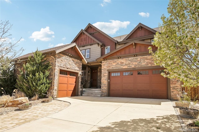 craftsman inspired home featuring driveway, stone siding, board and batten siding, and a garage