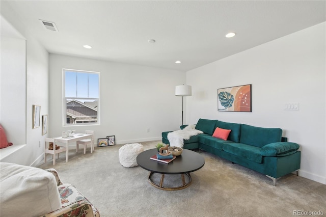 carpeted living room with recessed lighting, visible vents, and baseboards