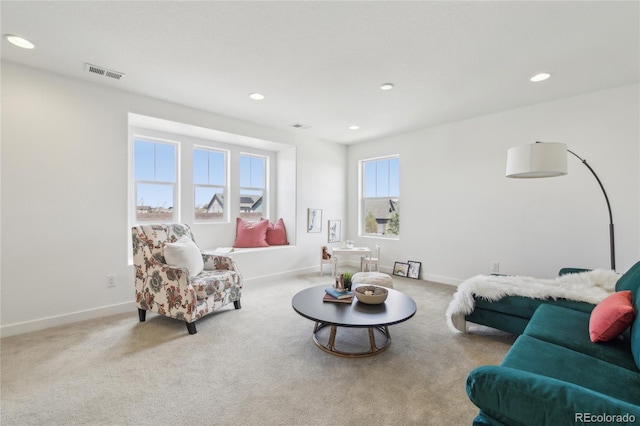 living room featuring baseboards, carpet floors, visible vents, and recessed lighting