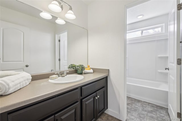full bathroom with baseboards and vanity