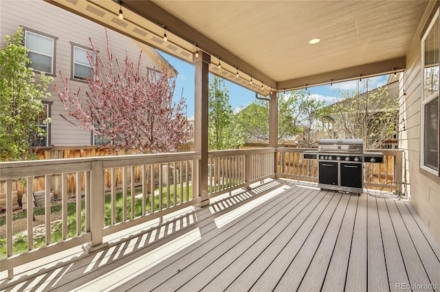wooden terrace featuring grilling area