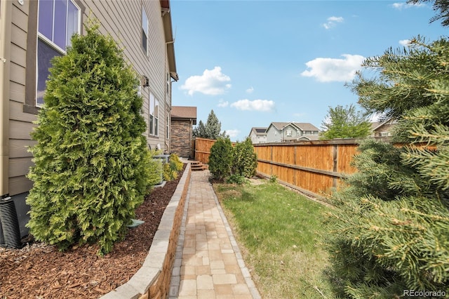 view of yard with a fenced backyard