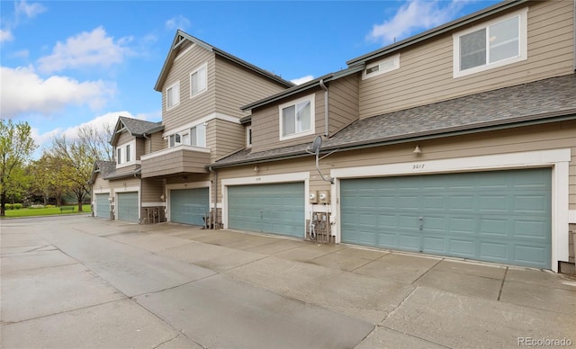 2017 N Fork Dr, Lafayette, CO 80026 - view of side of property featuring an attached garage and stone siding