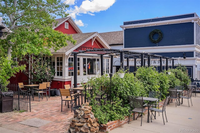2017 N Fork Dr, Lafayette, CO 80026 - view of patio / terrace featuring a pergola and outdoor dining space