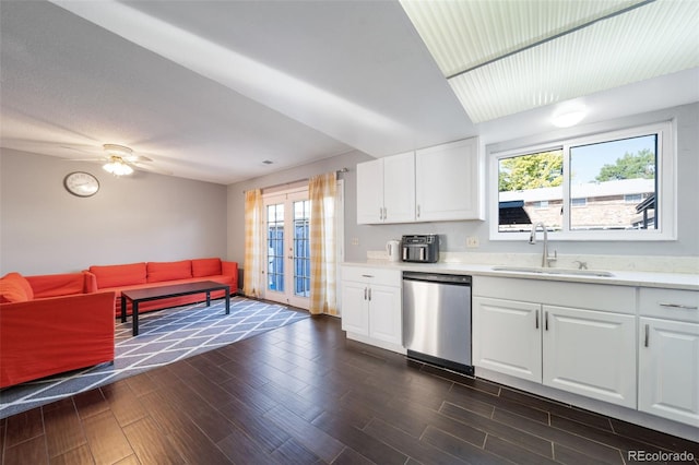 kitchen with dishwasher, dark hardwood / wood-style flooring, white cabinetry, and sink