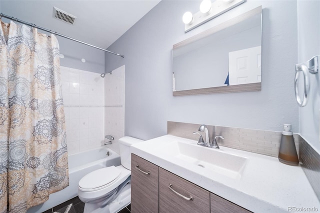 full bathroom with vanity, toilet, and shower / tub combo