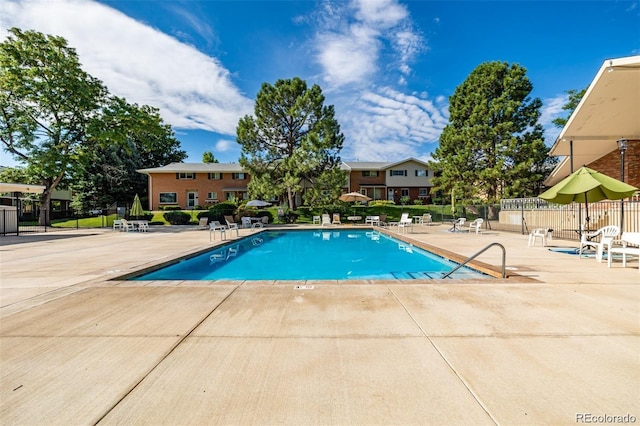 view of swimming pool featuring a patio