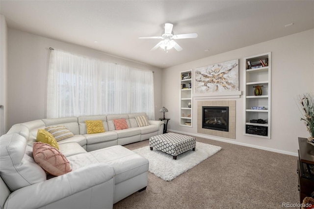 27029 E Irish Pl, Aurora, CO 80016 - living room with ceiling fan, a fireplace, built in shelves, and carpet