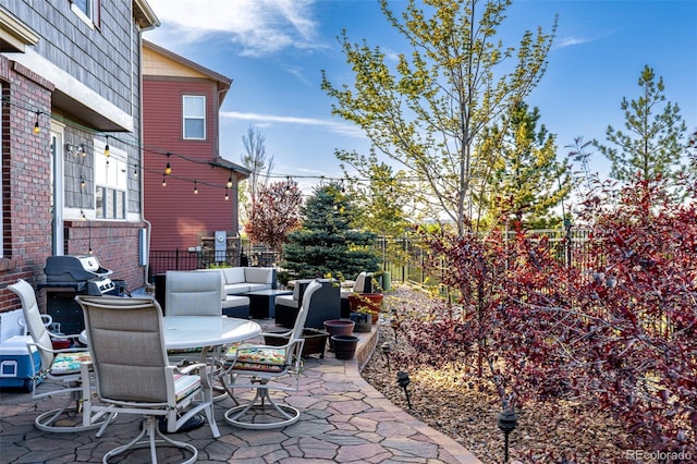 27029 E Irish Pl, Aurora, CO 80016 - fenced backyard with a patio, area for grilling, and outdoor dining space