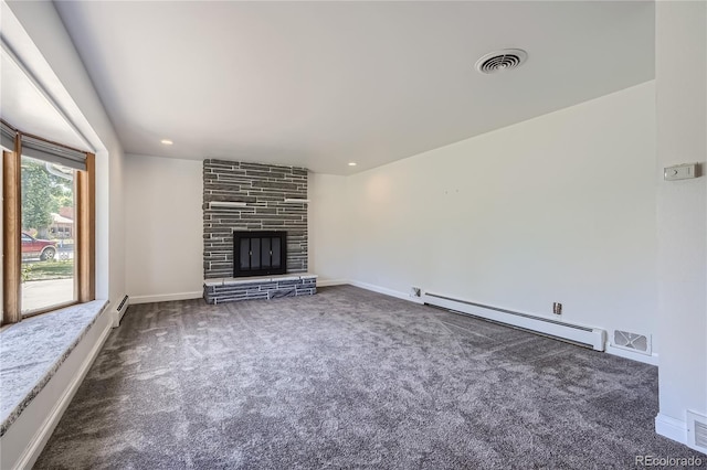 unfurnished living room with a fireplace, dark colored carpet, and a baseboard radiator