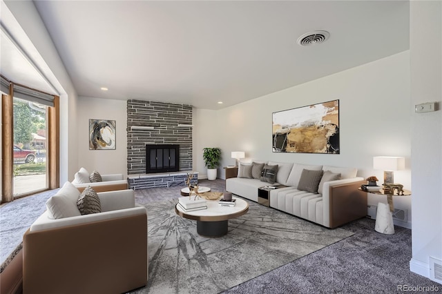 living room featuring a stone fireplace and light colored carpet