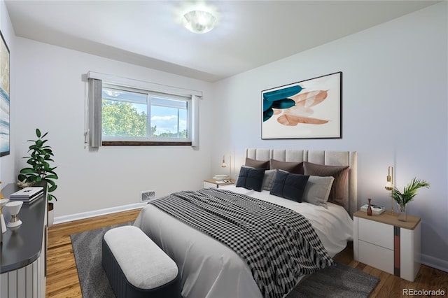 bedroom with hardwood / wood-style floors