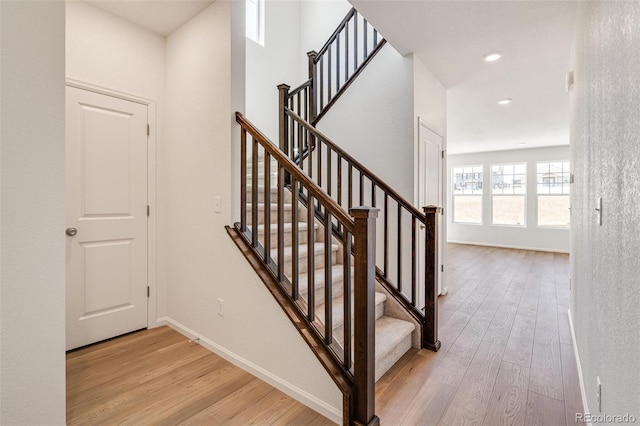 staircase with wood-type flooring