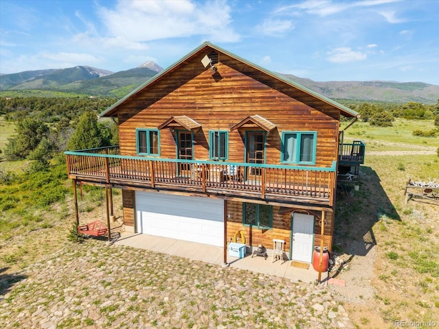 10 N Price Park, Cotopaxi, CO 81223 - view of front of house with a mountain view and an attached garage