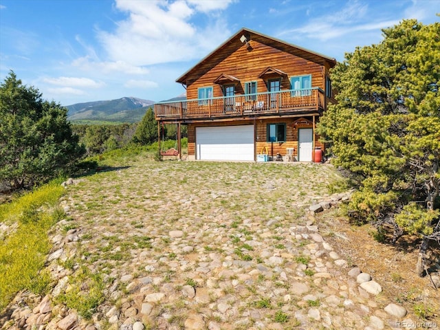 10 N Price Park, Cotopaxi, CO 81223 - view of front of house featuring a wooden deck and a garage