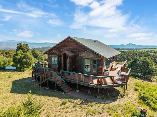 10 N Price Park, Cotopaxi, CO 81223 - rear view of property featuring a deck with mountain view and a lawn