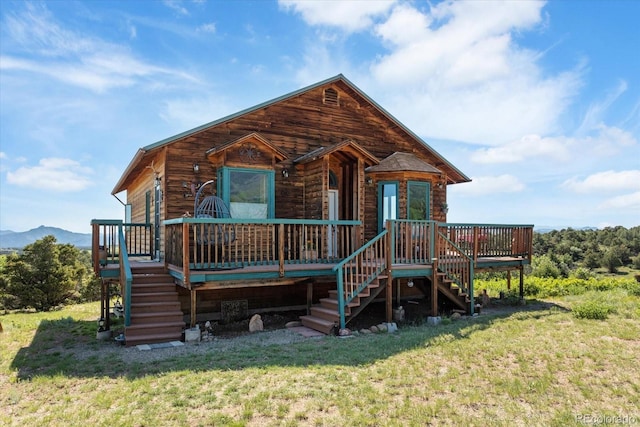 10 N Price Park, Cotopaxi, CO 81223 - view of front of house with stairway, a deck with mountain view, and a front lawn