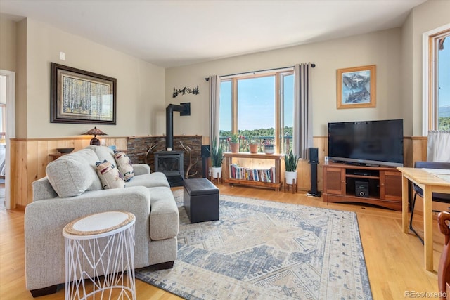 10 N Price Park, Cotopaxi, CO 81223 - living area featuring wood finished floors, a wood stove, and wainscoting