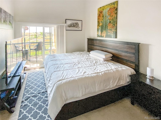 carpeted bedroom featuring access to exterior