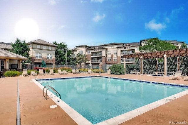 view of pool with a pergola and a patio