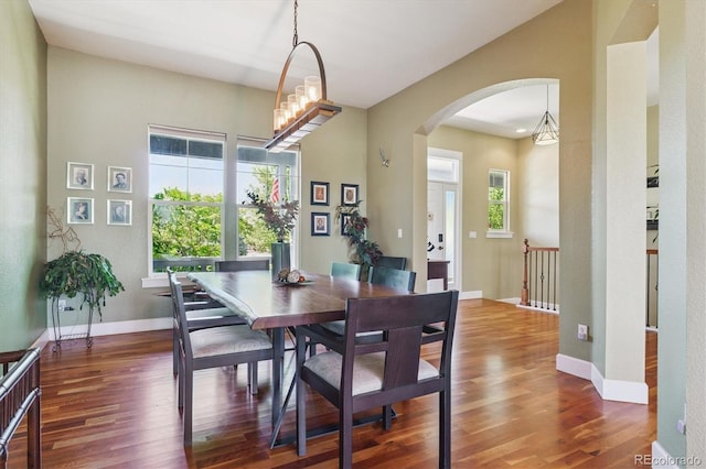 5463 Killen Ave, Castle Rock, CO 80104 - dining area with arched walkways and wood finished floors