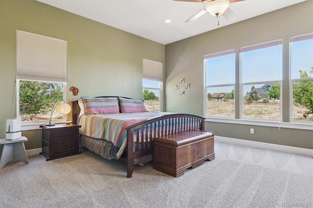 5463 Killen Ave, Castle Rock, CO 80104 - bedroom featuring light carpet, multiple windows, and a ceiling fan