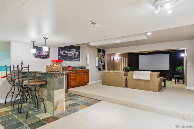 5463 Killen Ave, Castle Rock, CO 80104 - indoor wet bar with light colored carpet, decorative light fixtures, and recessed lighting