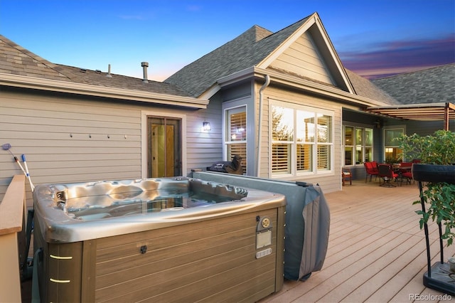 5463 Killen Ave, Castle Rock, CO 80104 - deck at dusk with a hot tub and outdoor dining area