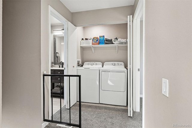 washroom with laundry area, carpet flooring, and washing machine and clothes dryer