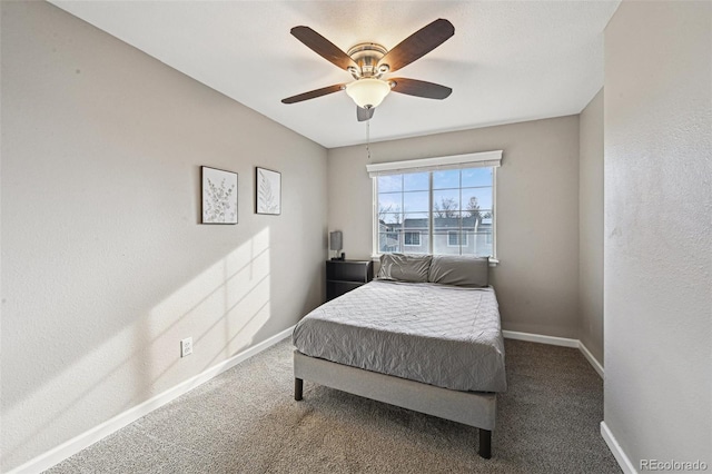 bedroom featuring a ceiling fan, carpet flooring, and baseboards