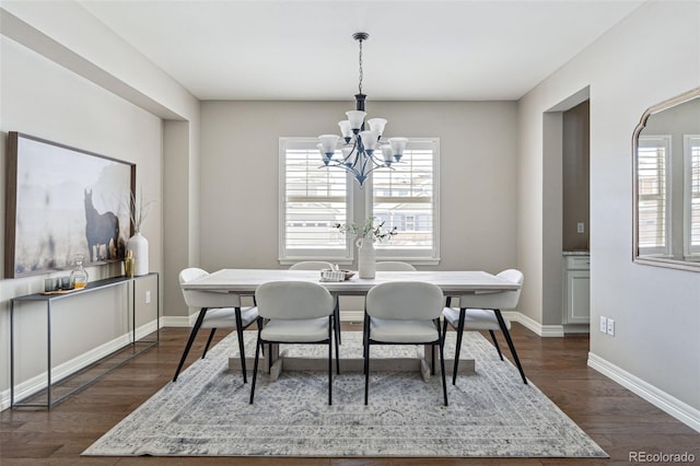 dining room with an inviting chandelier and dark wood-type flooring