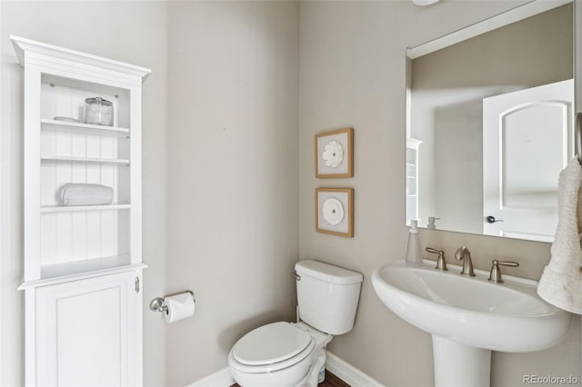 bathroom featuring sink and toilet