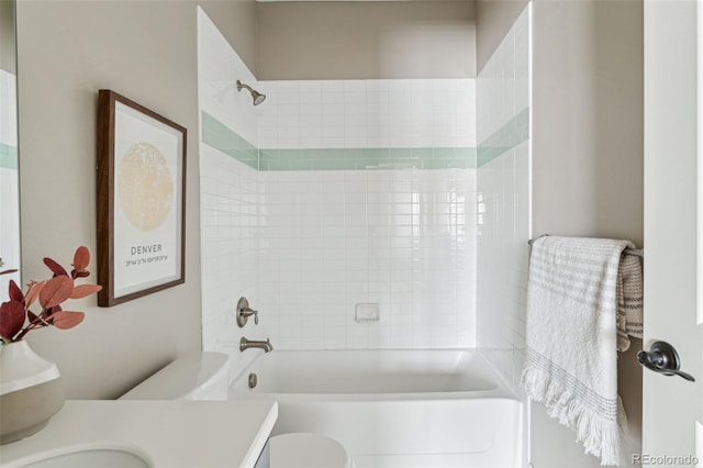 full bathroom with vanity, toilet, and tiled shower / bath combo