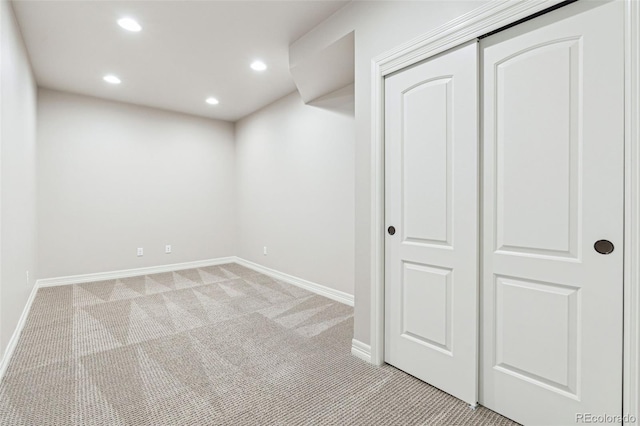 basement with light colored carpet