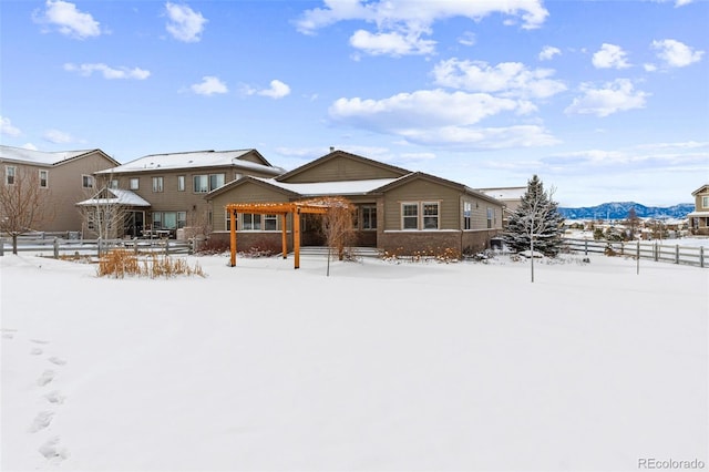 snow covered property with a mountain view