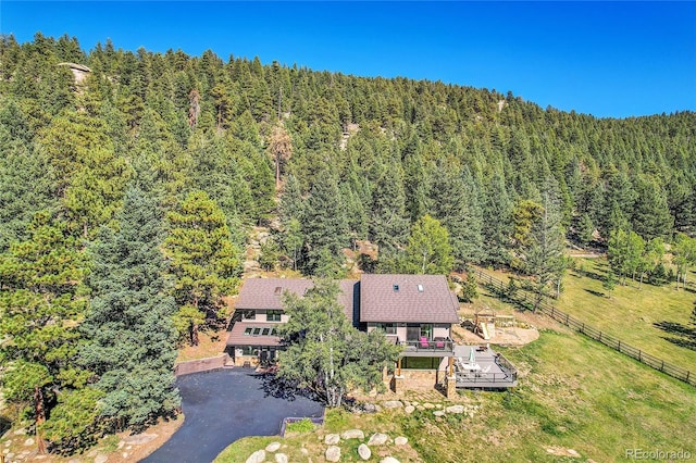 drone / aerial view featuring a view of trees