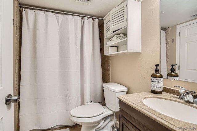 2838 Decatur St, Denver, CO 80211 - bathroom featuring toilet, vanity, and a shower with shower curtain
